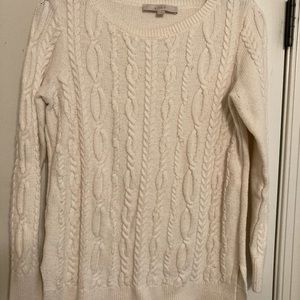 Cable knit sweater.